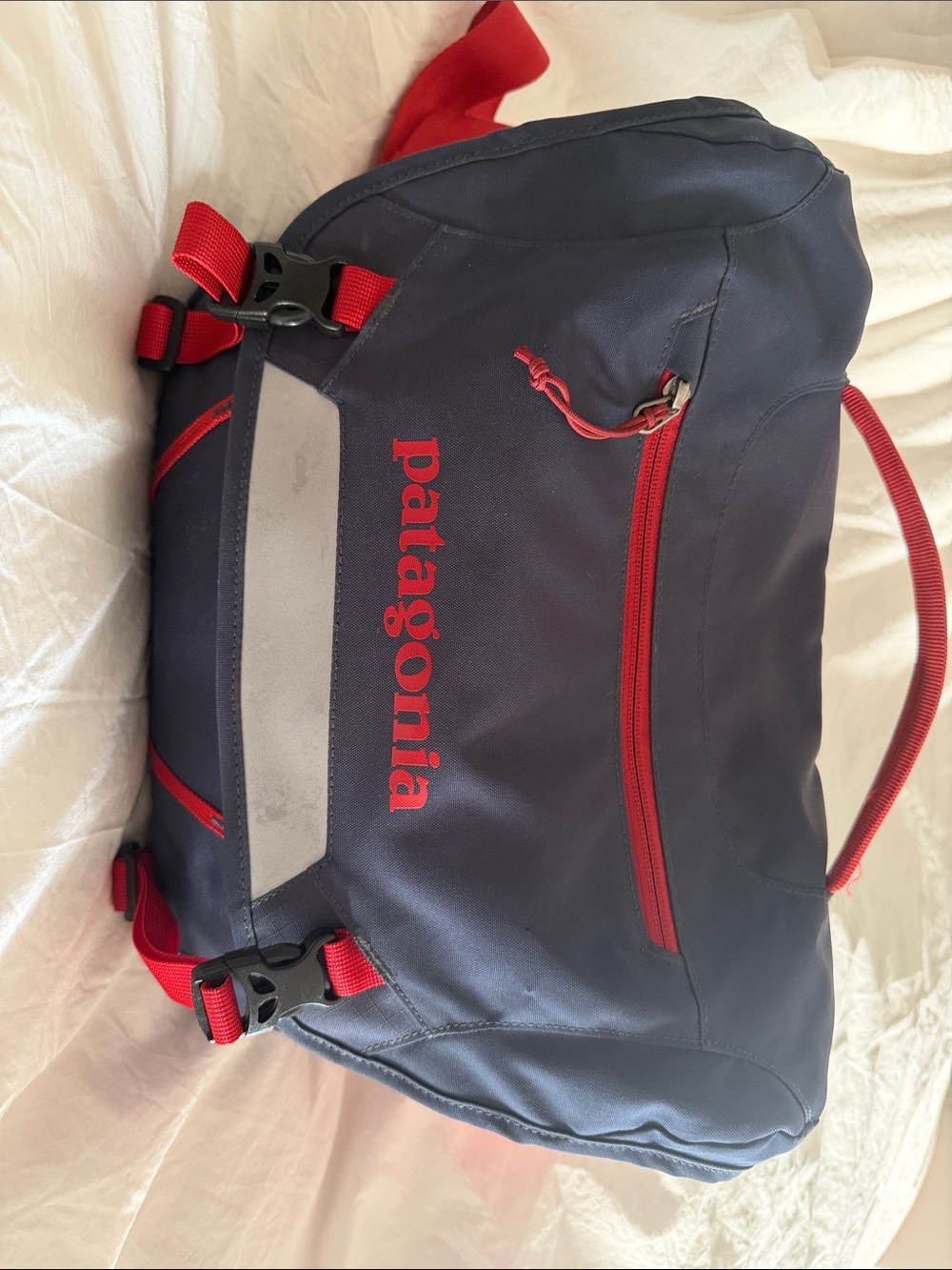 Patagonia Navy and Red Duffel Bag with Reflective Panel